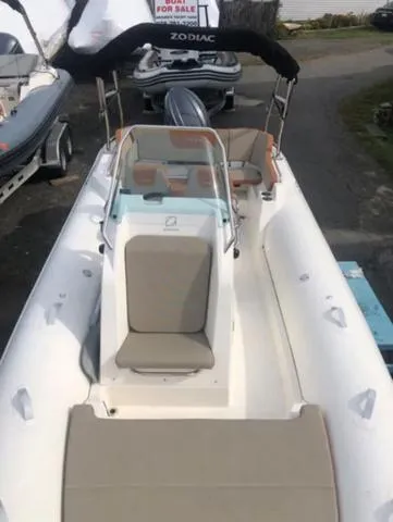 Slide: The Image of 2024 Zodiac Boats Medline 6.8, white inflatable boat with seating and console. - 10