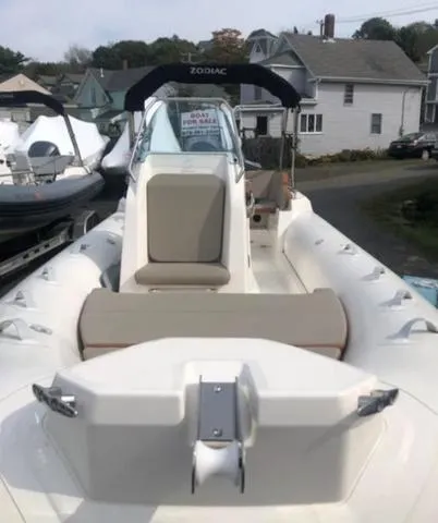 Slide: The Image of 2024 Zodiac Medline 6.8 boat with beige seating, docked in a residential area. - 8