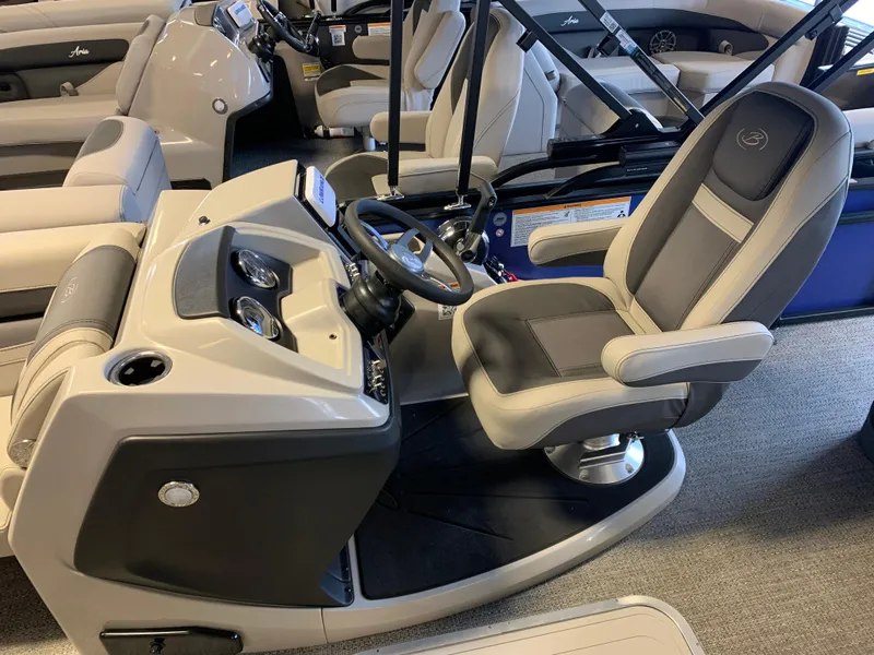 Slide: The Image of 2025 Barletta Cabrio 22U boat interior with steering console and captain's chair. - 4