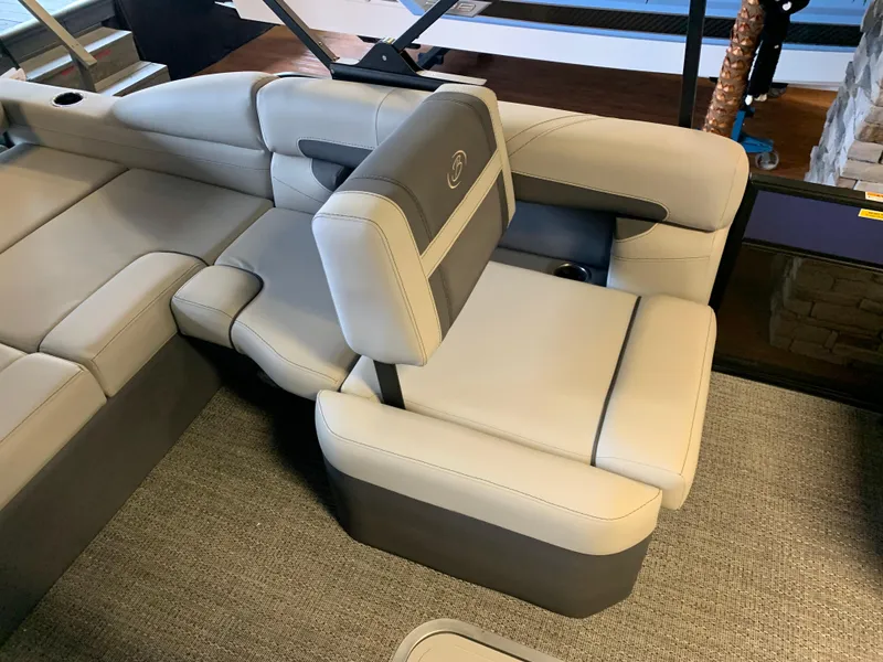 Slide: The Image of 2025 Barletta Cabrio 22U boat interior with luxurious beige seating and modern design. - 6