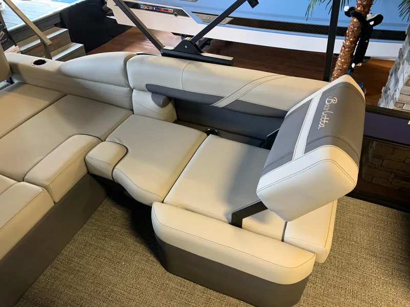 Slide: The Image of 2025 Barletta Cabrio 22U boat interior with luxurious seating and modern design. - 7