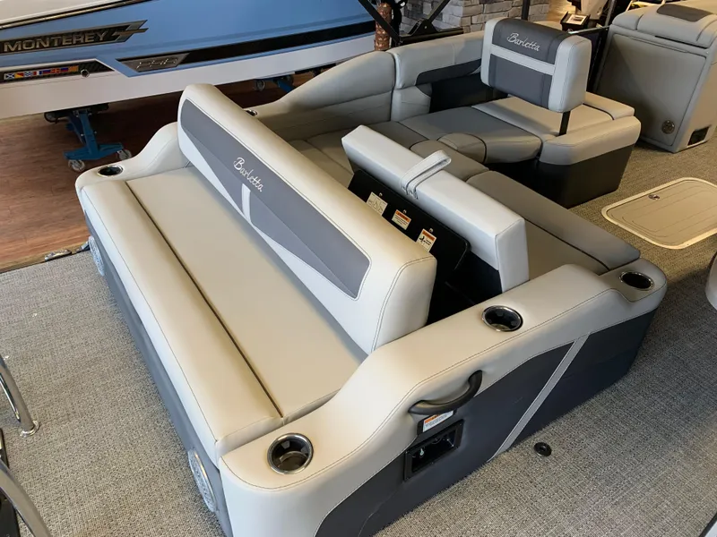 Slide: The Image of 2025 Barletta Cabrio 22U pontoon boat interior with gray seating and cup holders. - 9