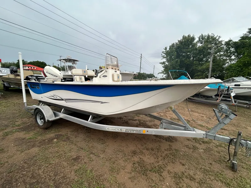 The Image of 2018 Carolina Skiff 198 DLV boat on trailer, parked outdoors. - 0