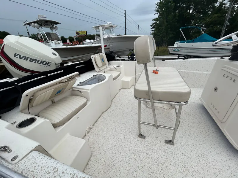Slide: The Image of 2018 Carolina Skiff 198 DLV boat interior with seating and Evinrude motor. - 11