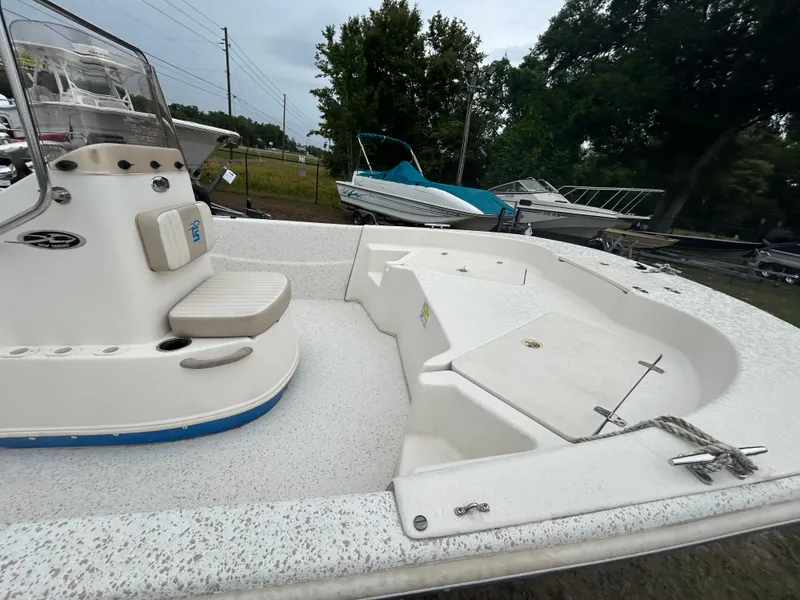 Slide: The Image of 2018 Carolina Skiff 198 DLV boat interior with seating and storage compartments. - 13