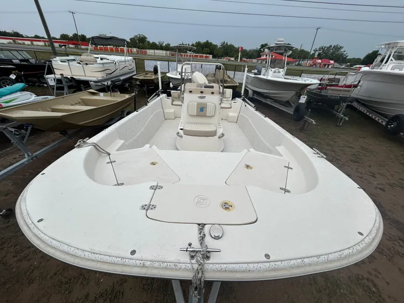 Slide: The Image of 2018 Carolina Skiff 198 DLV boat on display in a marina. - 14