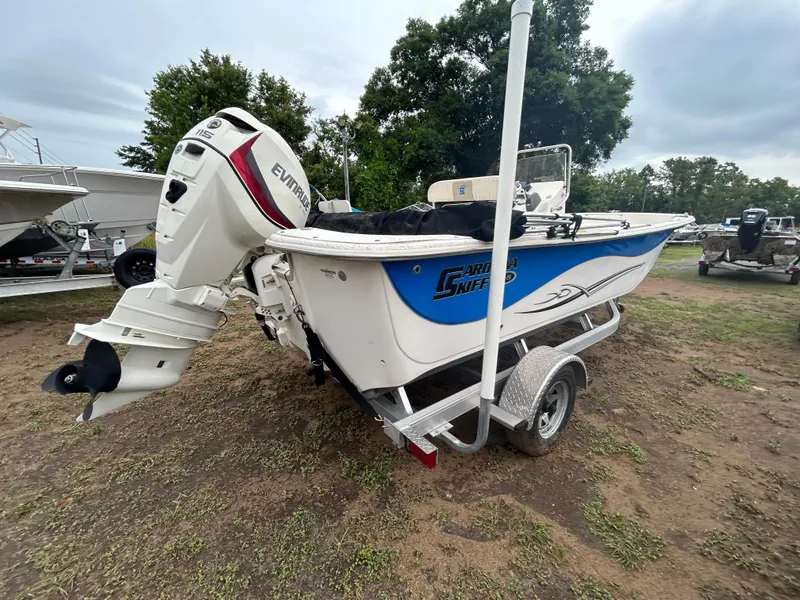Slide: The Image of 2018 Carolina Skiff 198 DLV boat on trailer with Evinrude outboard motor. - 2