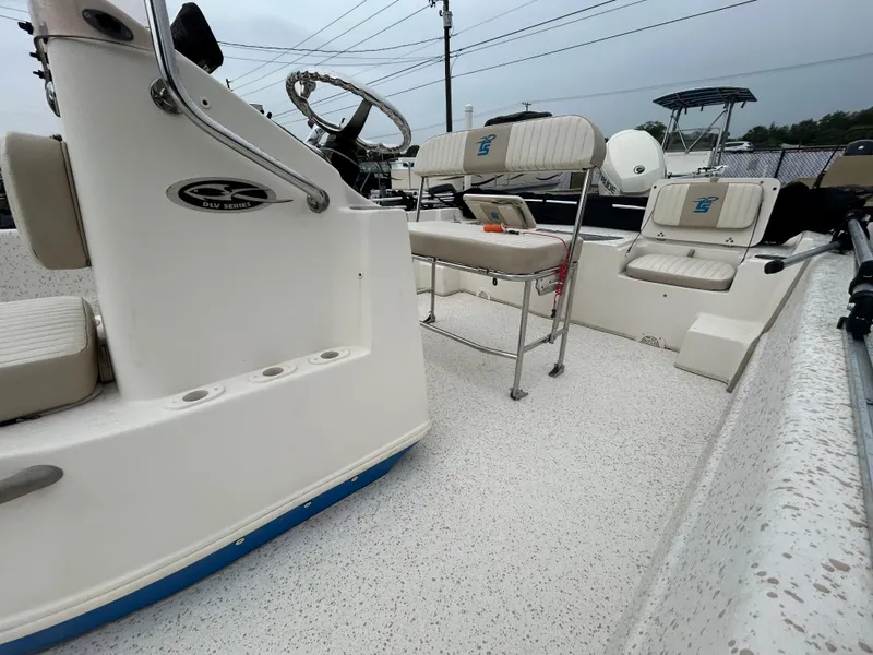 Slide: The Image of 2018 Carolina Skiff 198 DLV boat interior with seating and steering console. - 6