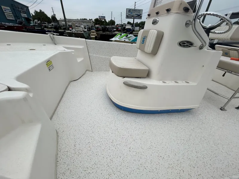 Slide: The Image of 2018 Carolina Skiff 198 DLV boat interior with seating and console. - 7