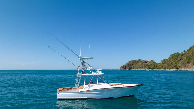 Slide: The Image of 2024 Maverick Yachts Costa Rica 36 Walkaround on serene ocean waters. - 10