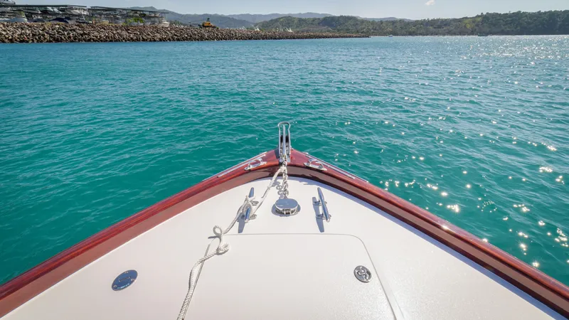 Slide: The Image of Bow view of 2024 Maverick Yachts Costa Rica 36 Walkaround on turquoise water. - 16