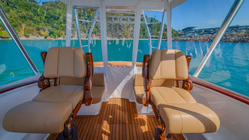 Slide: The Image of 2024 Maverick Yachts Costa Rica 36 Walkaround interior with luxurious seating and scenic ocean view. - 18