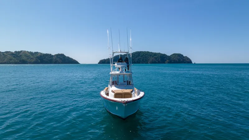 Slide: The Image of 2024 Maverick Yachts Costa Rica 36 Walkaround on serene ocean with distant islands. - 8