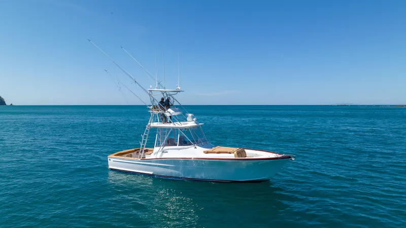 Slide: The Image of 2024 Maverick Yachts Costa Rica 36 Walkaround on open sea under clear blue sky. - 9