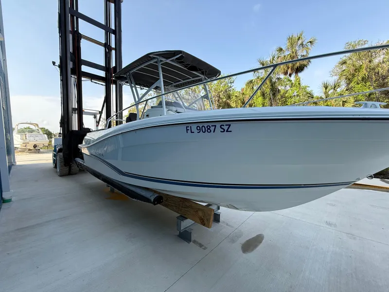 Slide: The Image of 2021 Jeanneau Leader 7.5 CC boat on forklift, outdoor setting, clear sky. - 11