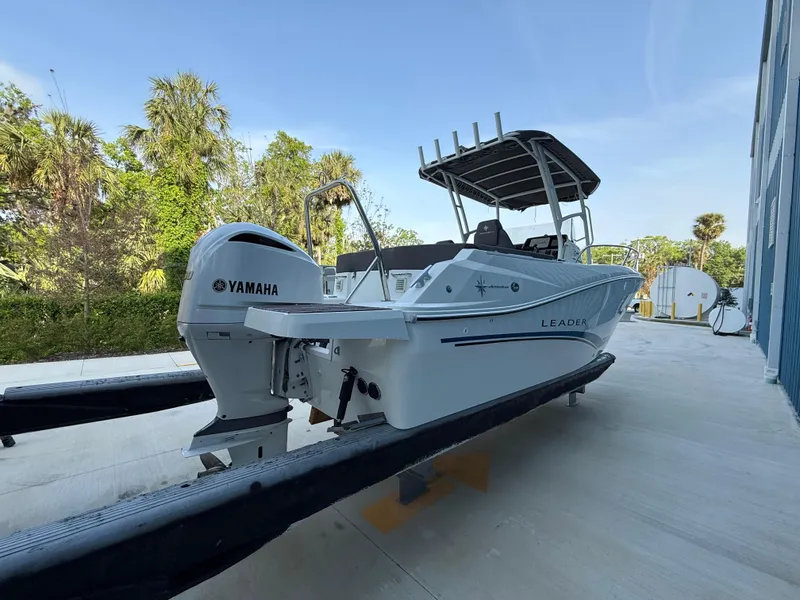 Slide: The Image of 2021 Jeanneau Leader 7.5 CC boat with Yamaha engine on trailer, outdoors. - 13