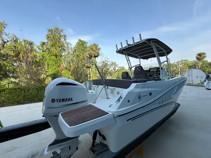 Slide: The Image of 2021 Jeanneau Leader 7.5 CC boat with Yamaha engine, parked outdoors. - 15