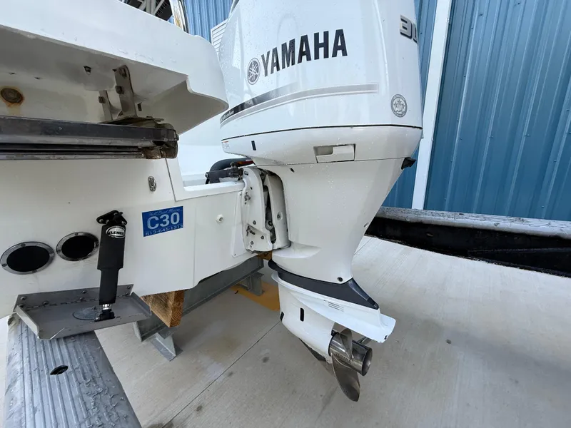 Slide: The Image of Outboard motor on a 2021 Jeanneau Leader 7.5 CC boat, featuring a Yamaha engine. - 20