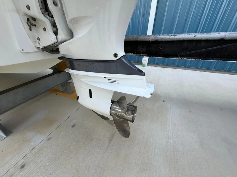 Slide: The Image of Outboard motor of 2021 Jeanneau Leader 7.5 CC boat on a trailer. - 21