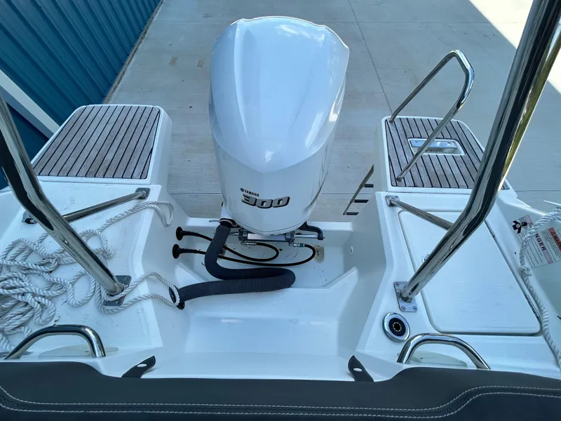 Slide: The Image of 2021 Jeanneau Leader 7.5 CC boat with Yamaha 300 outboard motor, docked. - 25