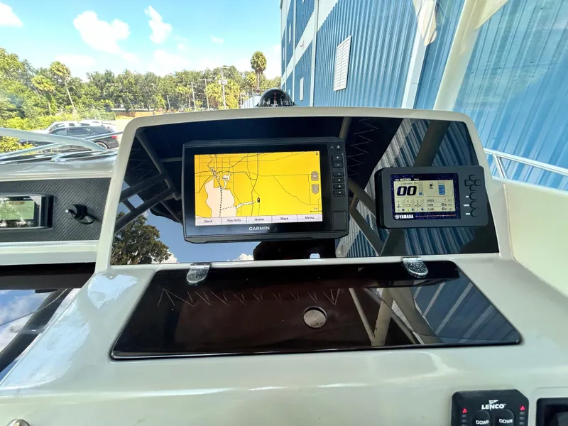 Slide: The Image of Dashboard of 2021 Jeanneau Leader 7.5 CC with navigation and control screens. - 31