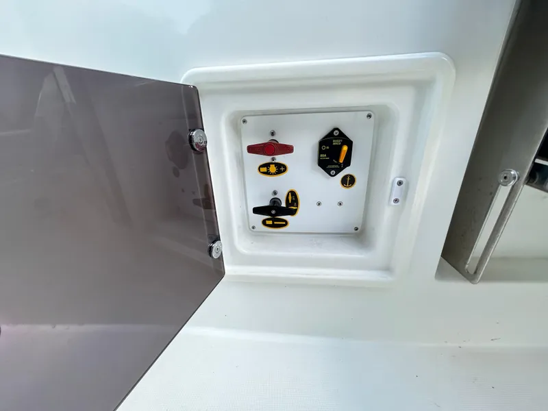 Slide: The Image of Control panel on 2021 Jeanneau Leader 7.5 CC boat with open access door. - 44