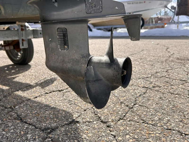 Slide: The Image of Propeller of a 1998 Boston Whaler 13 Sport boat on a trailer. - 22