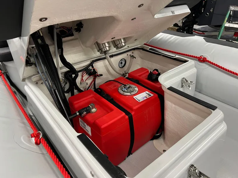 Slide: The Image of 2023 Zodiac Open 4.2 boat showing red fuel tank and internal components. - 10