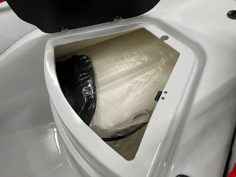 Slide: The Image of Storage compartment of 2023 Zodiac Open 4.2 boat, featuring a sleek design. - 12