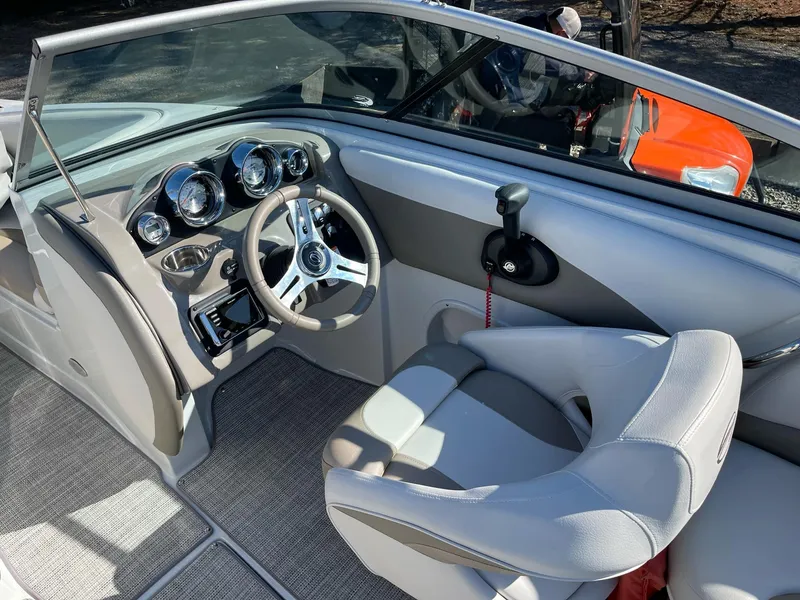 Slide: The Image of 2020 Crownline 205 SS boat interior with modern dashboard and steering wheel. - 10
