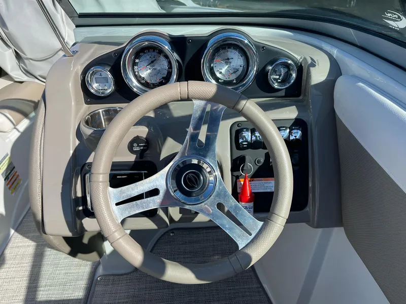 Slide: The Image of Dashboard of 2020 Crownline 205 SS boat with steering wheel and gauges. - 11