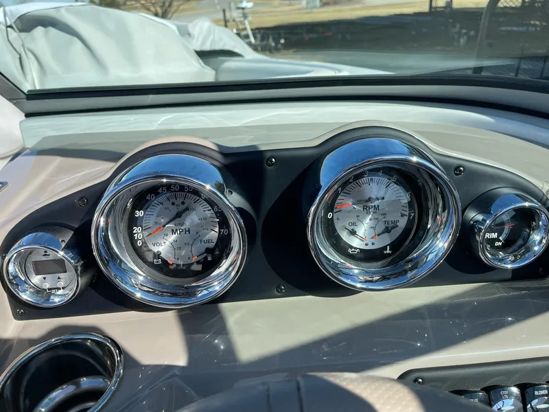 Slide: The Image of Dashboard of 2020 Crownline 205 SS boat with speedometer and RPM gauges. - 12