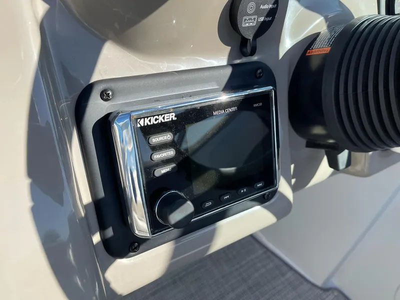 Slide: The Image of Kicker media center on 2020 Crownline 205 SS boat dashboard. - 13