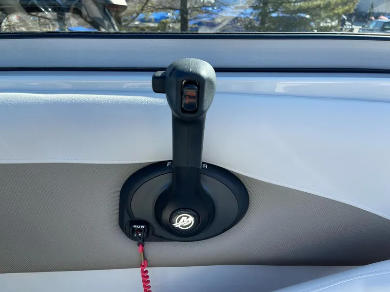 Slide: The Image of Throttle control of 2020 Crownline 205 SS boat, featuring a sleek design. - 15