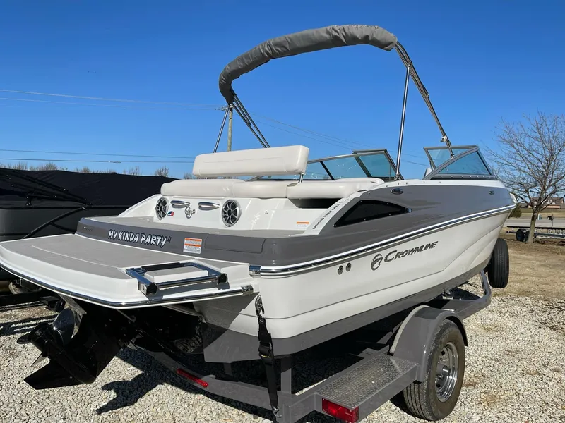 Slide: The Image of 2020 Crownline 205 SS boat on trailer, featuring sleek design and modern amenities. - 3