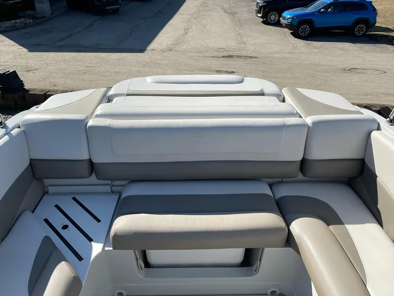Slide: The Image of 2020 Crownline 205 SS boat interior with beige and white seating. - 7