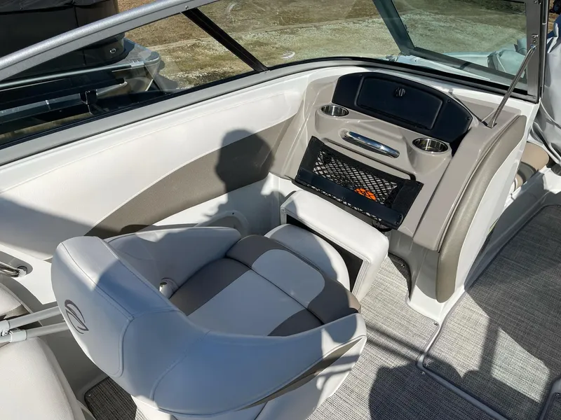 Slide: The Image of Interior of a 2020 Crownline 205 SS boat with modern seating and dashboard. - 9