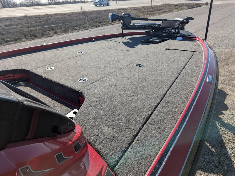 Slide: The Image of 2023 Nitro Z20 boat deck with trolling motor on a sunny day. - 18