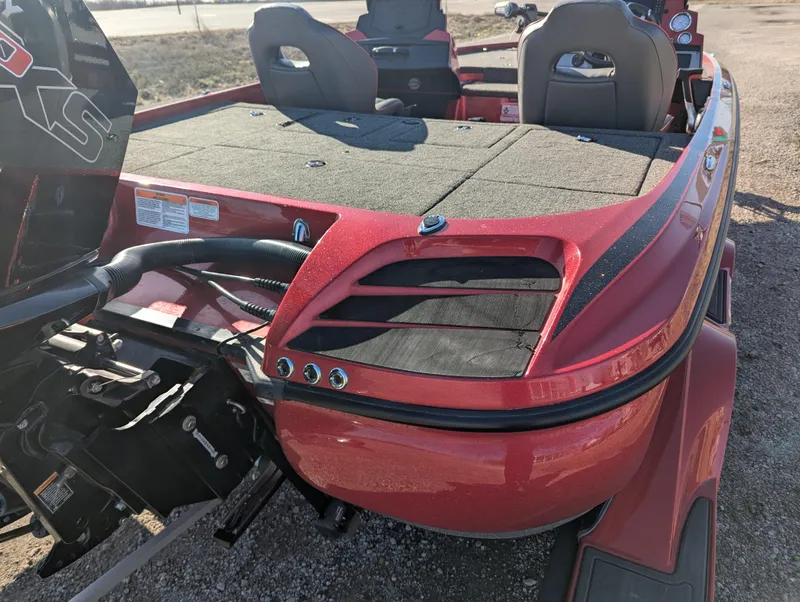 Slide: The Image of 2023 Nitro Z20 boat, red exterior, rear view with seating and motor details. - 19