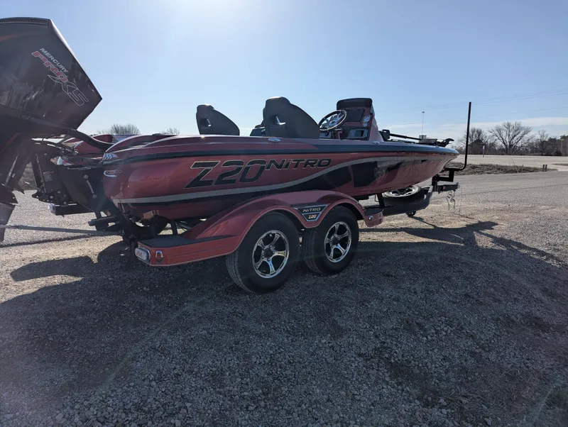 Slide: The Image of 2023 Nitro Z20 boat on trailer in outdoor setting. - 8