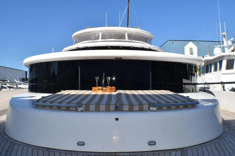 Slide: The Image of Luxury yacht deck with sunbeds, Johnson Country Kitchen 2006 model, under clear blue sky. - 1