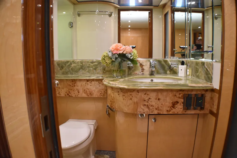 Slide: The Image of Luxurious 2006 Johnson Country Kitchen bathroom with marble countertop and elegant floral arrangement. - 21