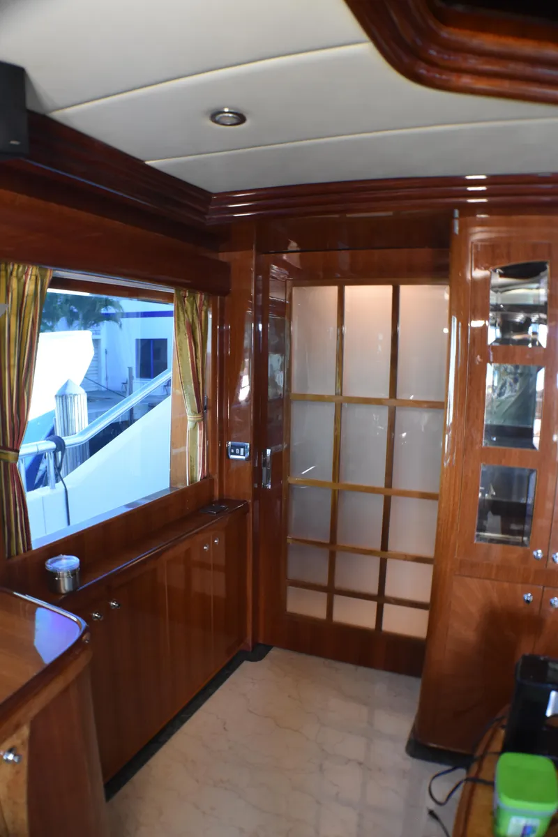 Slide: The Image of Luxurious 2006 Johnson Country Kitchen interior with wooden cabinetry and frosted glass door. - 26