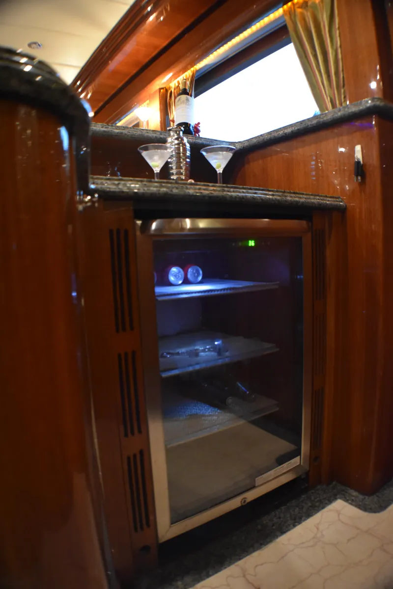 Slide: The Image of Luxurious 2006 Johnson Country Kitchen with elegant wooden cabinetry and built-in mini fridge. - 34