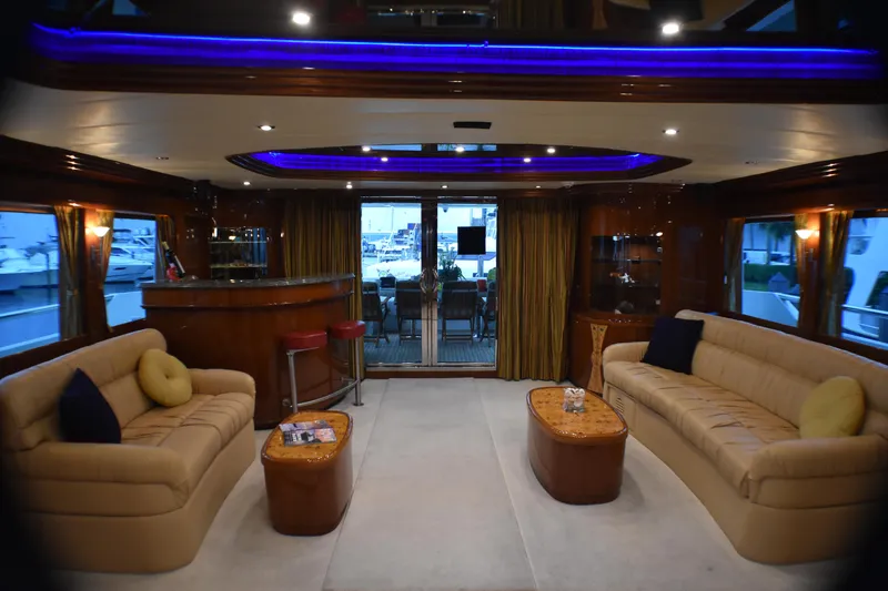 Slide: The Image of Luxurious 2006 Johnson Country Kitchen yacht interior with sofas, bar, and ambient lighting. - 36