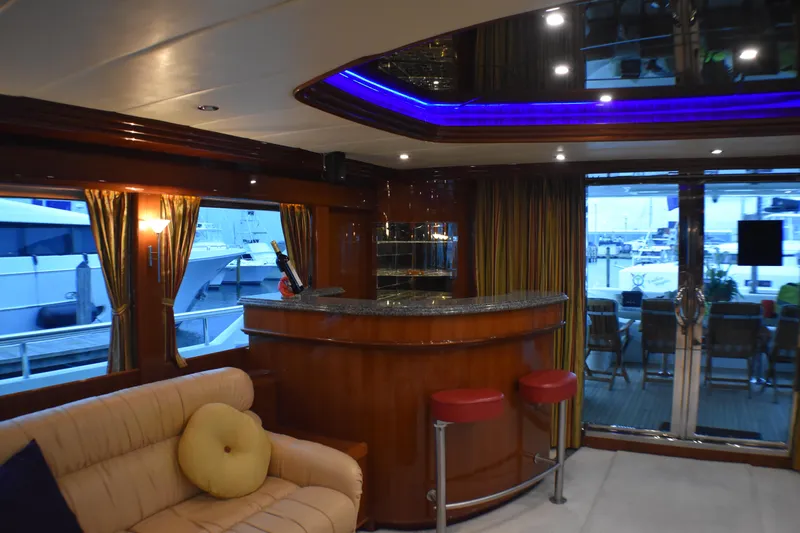 Slide: The Image of Luxurious yacht interior with bar, plush seating, and ambient lighting, Johnson Country Kitchen 2006 model. - 39