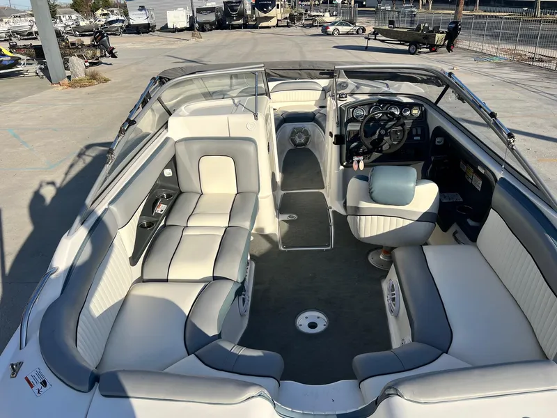 Slide: The Image of 2008 Yamaha Boats SX230 High Output interior with spacious seating and modern dashboard. - 11