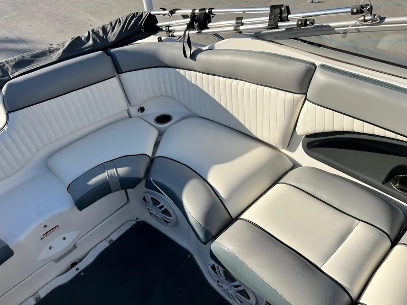 Slide: The Image of 2008 Yamaha SX230 High Output boat interior with white and gray seating. - 14