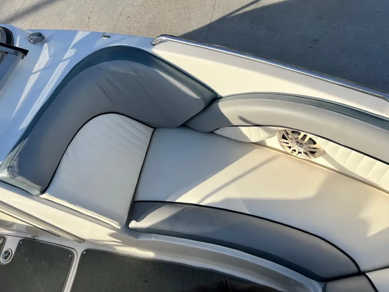 Slide: The Image of 2008 Yamaha SX230 High Output boat interior with cushioned seating and speaker. - 15