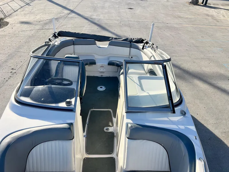 Slide: The Image of 2008 Yamaha Boats SX230 High Output interior with seating and open windshield. - 16